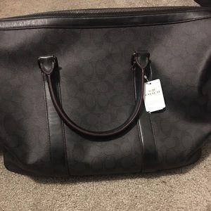 Coach voyager bag bought at $599, never used.